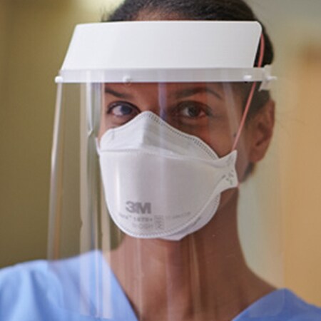 Clinician wearing a filtering facepiece respirator
