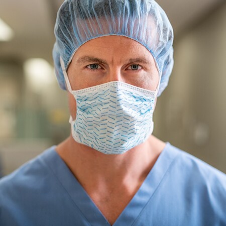 Clinician wearing a surgical mask