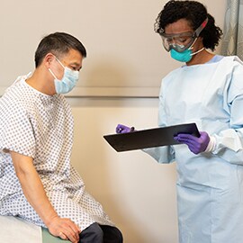 Patient and medical staff wearing N95 respirators