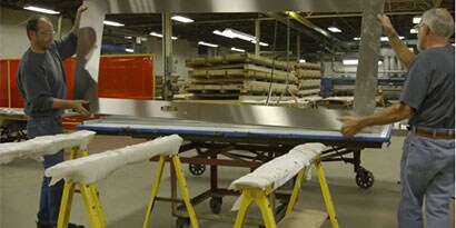 Still shot from a video talking about Dawson Doors eliminating production steps by switching to a 3M structural adhesive
