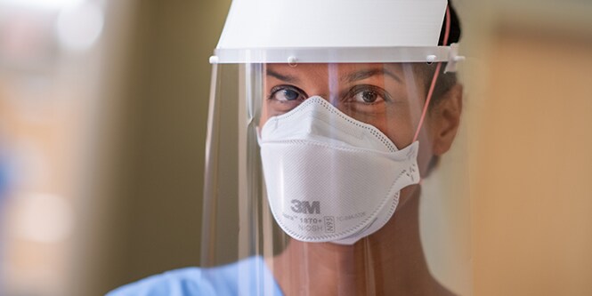 Clinician wearing a filtering facepiece respirator
