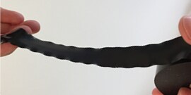 hands releasing tape on roll of Scotch® Vinyl Electrical Tape Super 33+™