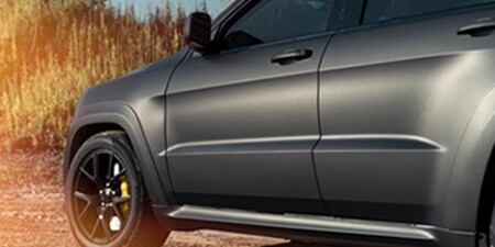 Black car with full coverage color wrap film
