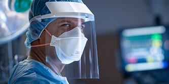Clinician wearing a filtering facepiece respirator
