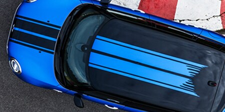 Blue car with partial coverage color wrap film
