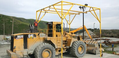 Fall protection access system  around large earthmoving equipment undergoing maintenance
