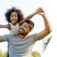 Young child riding on her fathers back.